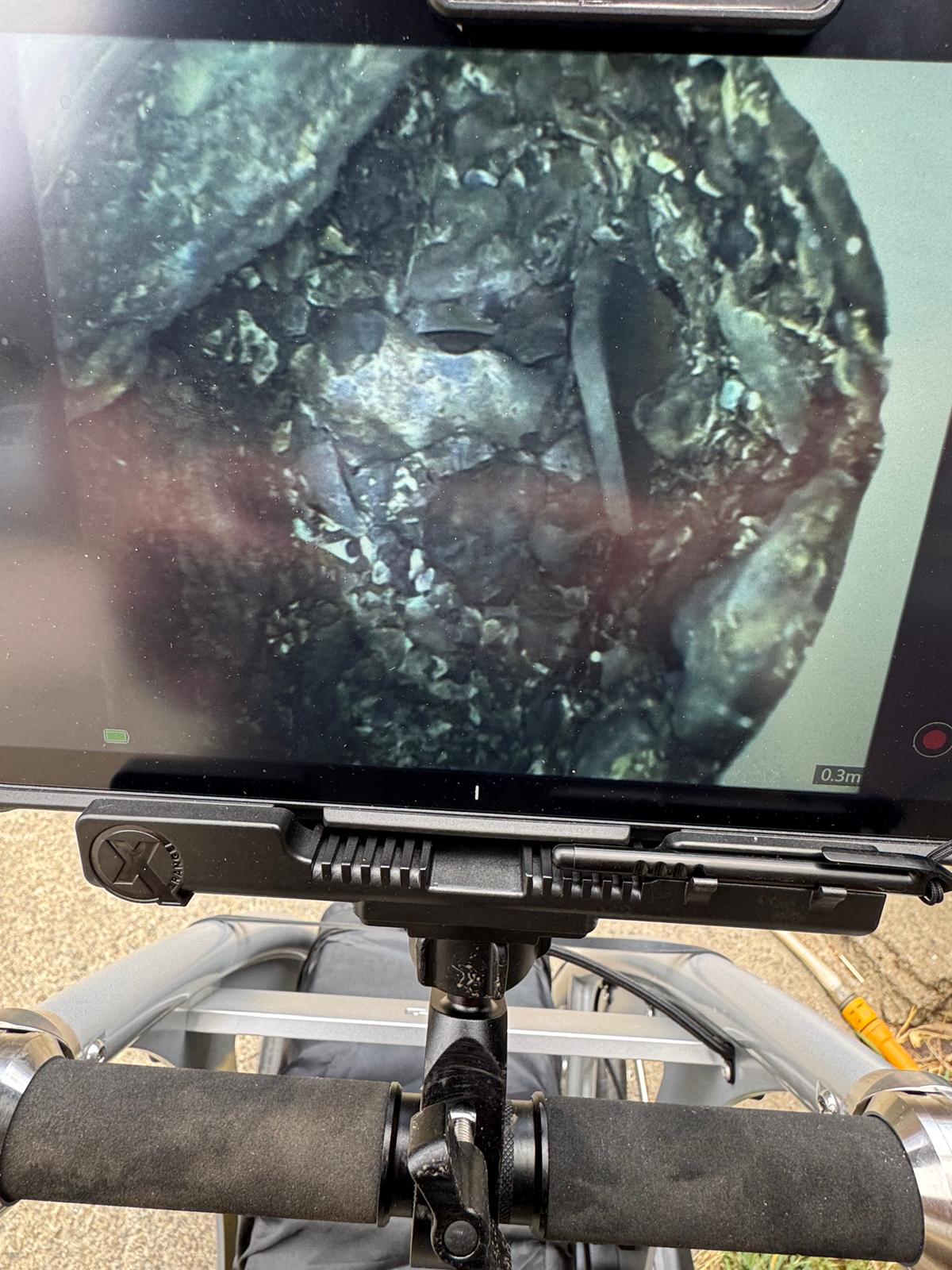 Close-up CCTV footage of root ingress in pipe